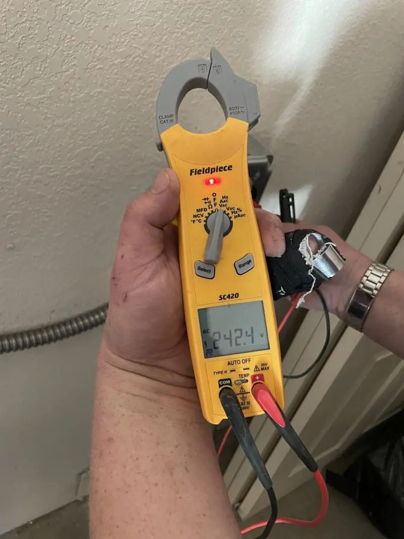 Voltage testing with clamp meter during Outlet Installation in Englewood Cliffs